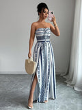 👗 50% OFF NOW! 💥 Geometric Jumpsuit with Halter Neckline & Side Slit – Unique print & elastic back – Versatile. perfect for summer parties or resort wear ✨