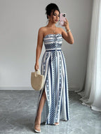 👗 50% OFF NOW! 💥 Geometric Jumpsuit with Halter Neckline & Side Slit – Unique print & elastic back – Versatile. perfect for summer parties or resort wear ✨