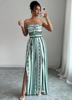👗 50% OFF NOW! 💥 Geometric Jumpsuit with Halter Neckline & Side Slit – Unique print & elastic back – Versatile. perfect for summer parties or resort wear ✨